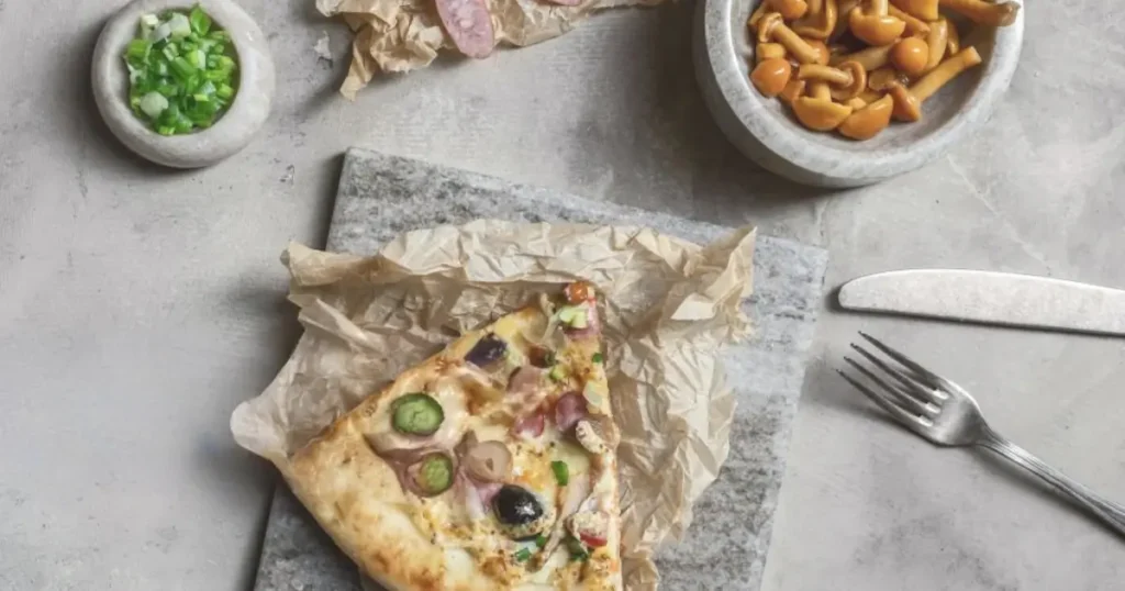 A delicious Pickle Pie Pizza topped with fresh pickles, melted cheese, and a golden crust, perfect for a unique and bold flavor experience.